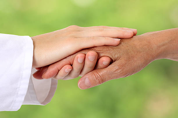 istock Woman hand helping senior in nature 480537670