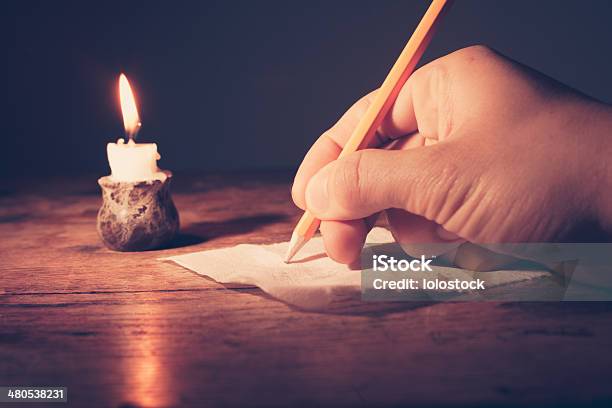 Writing By Candlelight Stock Photo - Download Image Now - Candle, Close-up, Concepts