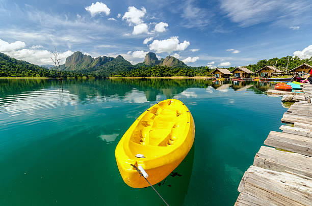 istock Yellow canoe in a beautiful mountains lake forest and river 480540524