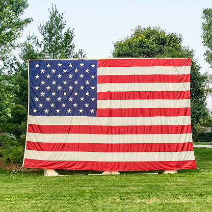 Giant U.S. flag on display in a suburban neighborhood on the Fourth of July