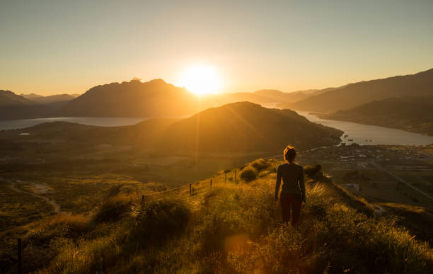 istock Woman silhouette at sunset on the mountain 480542250
