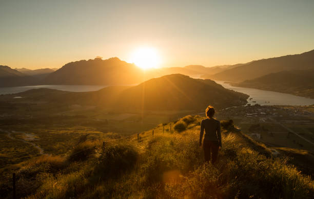 Woman silhouette at sunset on the mountain Woman silhouette at sunset on the mountain. New Zealand new zealand photos stock pictures, royalty-free photos & images