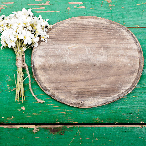 istock Oval plaque and a bouquet of flowers 480548802