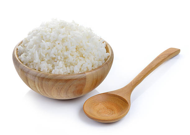 istock rice in wood bowl on white background 480549518