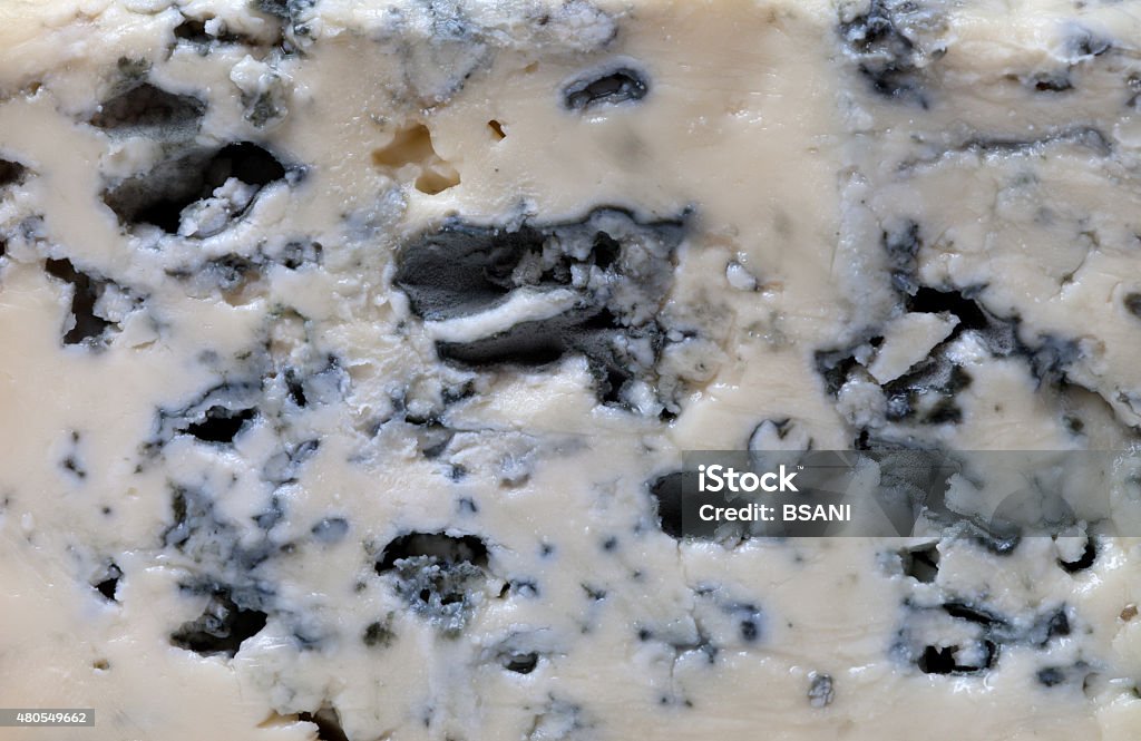 Slice of blue cheese Slice of blue cheese. Macro. 2015 Stock Photo