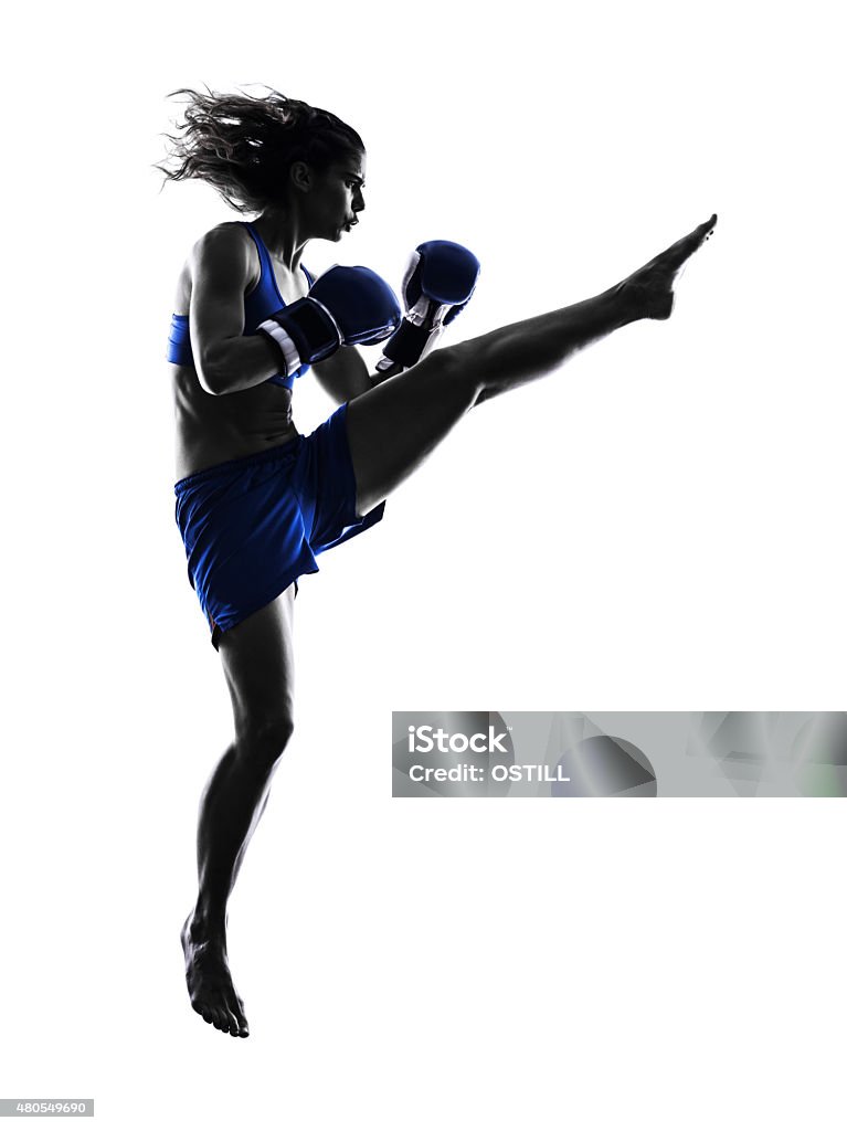woman boxer boxing kickboxing silhouette isolated one woman boxer boxing kickboxing in silhouette isolated on white background Muay Thai Stock Photo