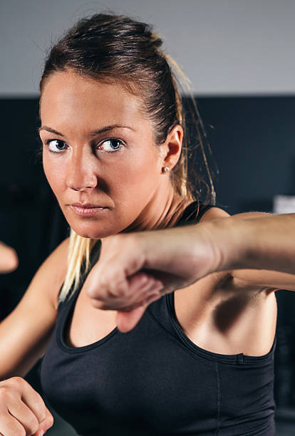 istock Woman training hard boxing in the gym 480549978