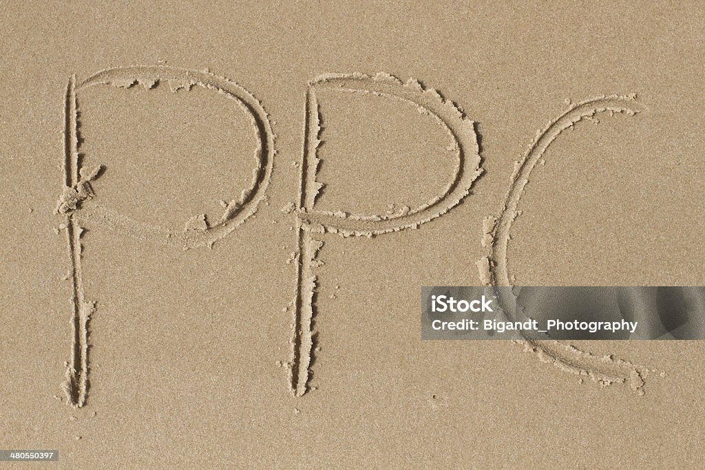 As letras PPC desenhada na Areia - Royalty-free Abreviatura Foto de stock