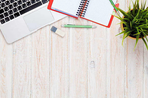 istock Office desk table with computer, supplies and flower 480552410
