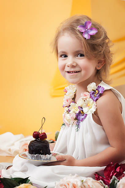 istock Pretty little girl posing with chocolate cake 480553003