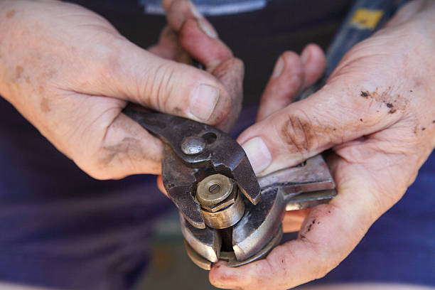 istock Working on lawn sprinkler head with dirty hands 480553492