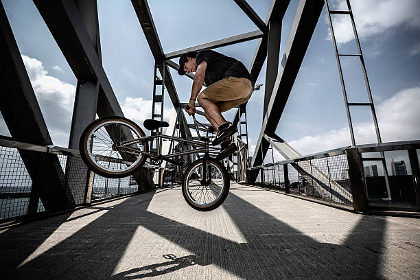 istock BMX rider in city jumping 480557008