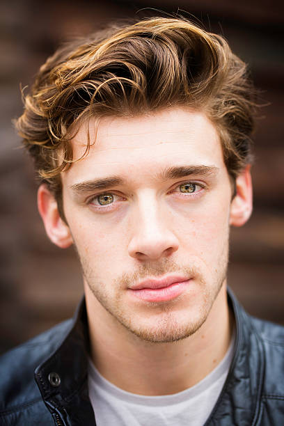 istock Sad young male British student headshot with wavy hair 480557230