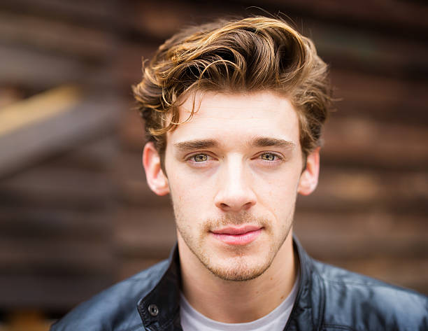 istock Pensive young British student with dreamy eyes and leather jacket 480557236