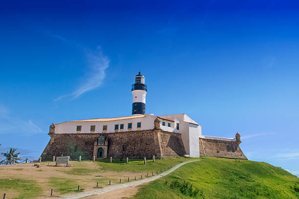 Salvador, BA, Brazil - October 1st, 2012: In a beautiful and sunny day, nobody is arround Farol da Barra, a city landmark, built in the 17th century.