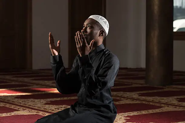 Photo of African Muslim Man Praying At Mosque