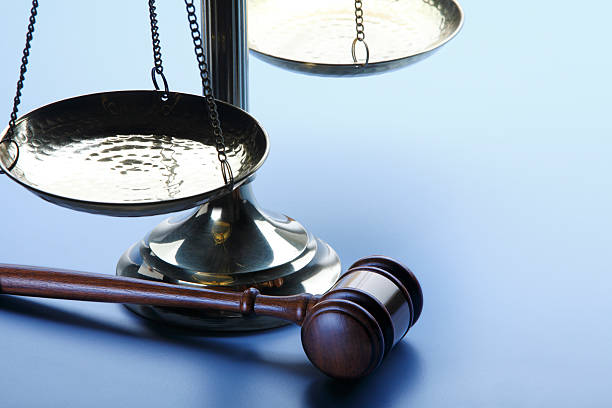 istock Gavel And Scales Of Justice On A Blue Background 480560810