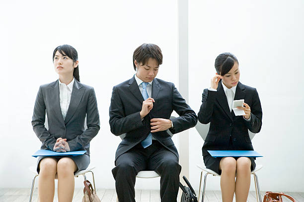 Men and women waiting their turn for interview stock photo