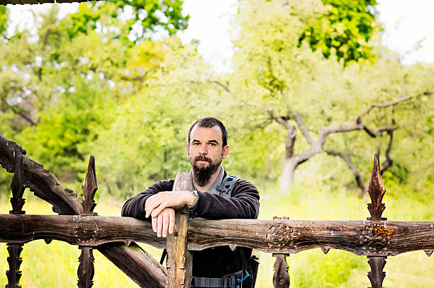 istock Young Man Leaning on a Fence 480561178