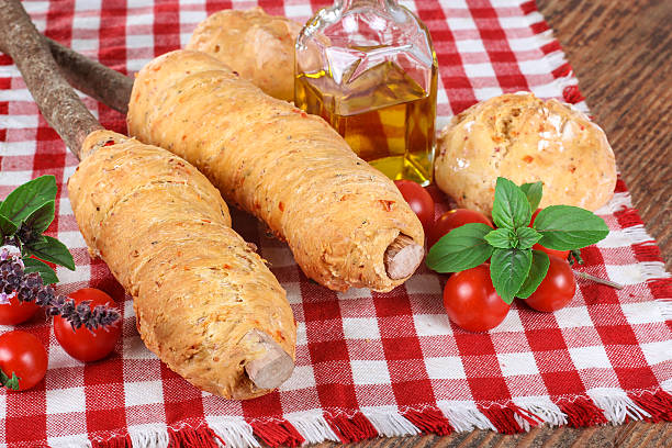 istock Barbecue with fresh baked bread around a stick 480563453