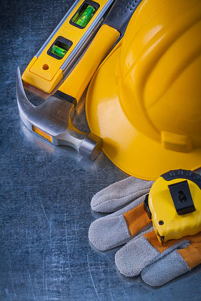 istock Safety working gloves hard hat construction level tape-line and 480567204