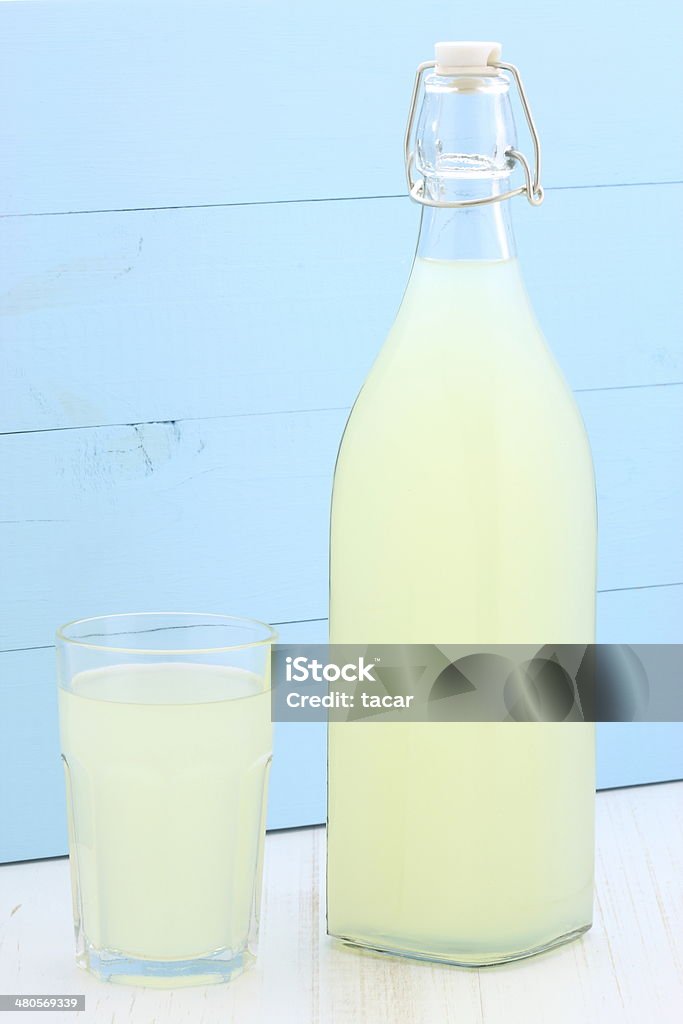fresh lemonade delicious and nutritious, organic lemonade on vintage bottle and glass Alcohol - Drink Stock Photo