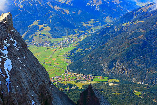 View of alpine villages from Zugspitze - Germany Austria View of alpine villages from Zugspitze - Germany and Austria border. ehrwald stock pictures, royalty-free photos & images