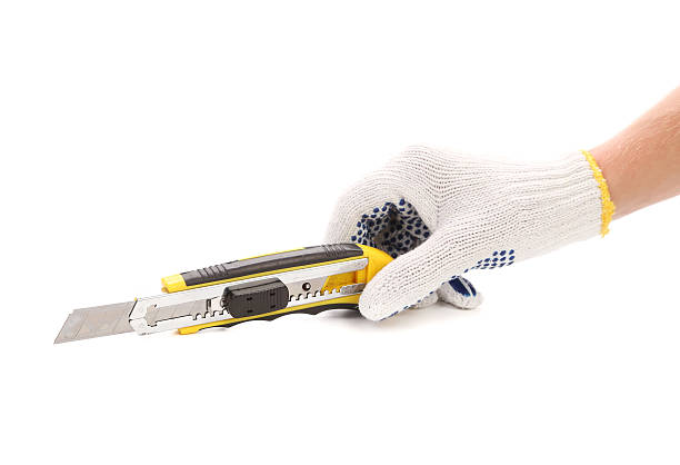 istock Hand in gloves holding knife. 480572699