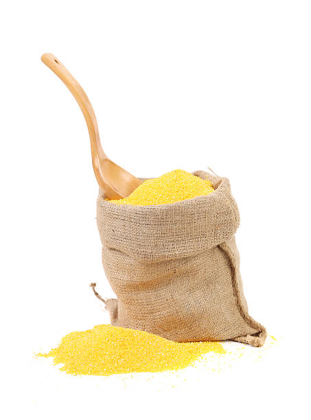 istock Cornmeal in burlap with wooden spoon. 480573059
