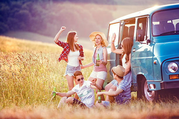 istock Young hipster friends on road trip 480573160