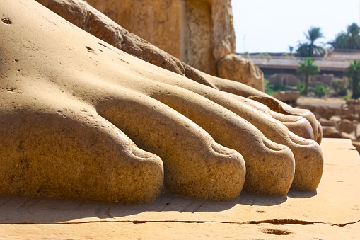 Photo of large feet of a statue at the Temple of Karnak, Luxor, Egypt.