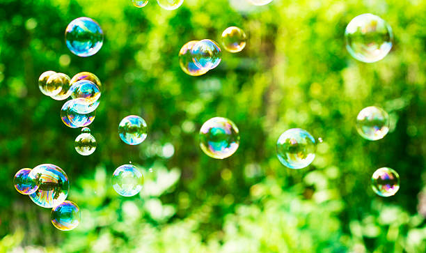 istock Soap bubbles floating in the air outside 480576230