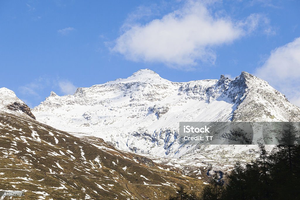 Mountain peak High mountain peak with snow in the alps Aerial View Stock Photo