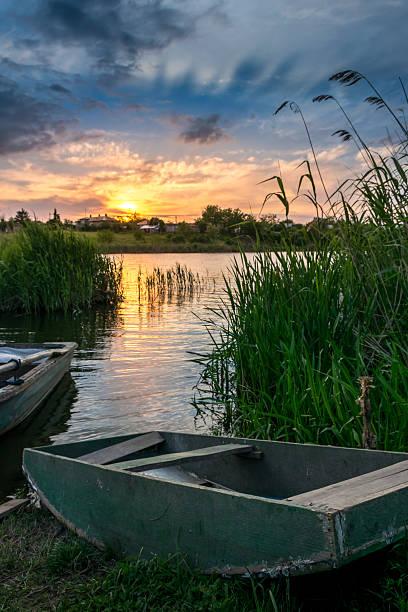 istock Boats resting on the lake at sunset 480579142