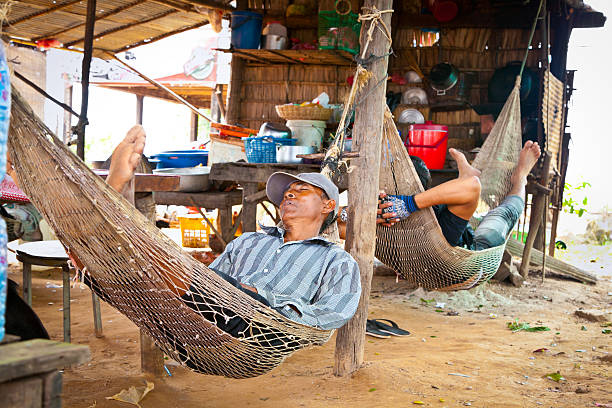 Cambodian people live beside Tonle Sap Lake. Cambodia. Siem Reap, Cambodia- November 22, 2013:  The ordinary life of people beside Tonle Sap Lake in Siem Reap, Cambodia on Nov 22, 2013. Tonle Sap is the largest freshwater lake in SE Asia peaking at 16k km2 khmer stock pictures, royalty-free photos & images
