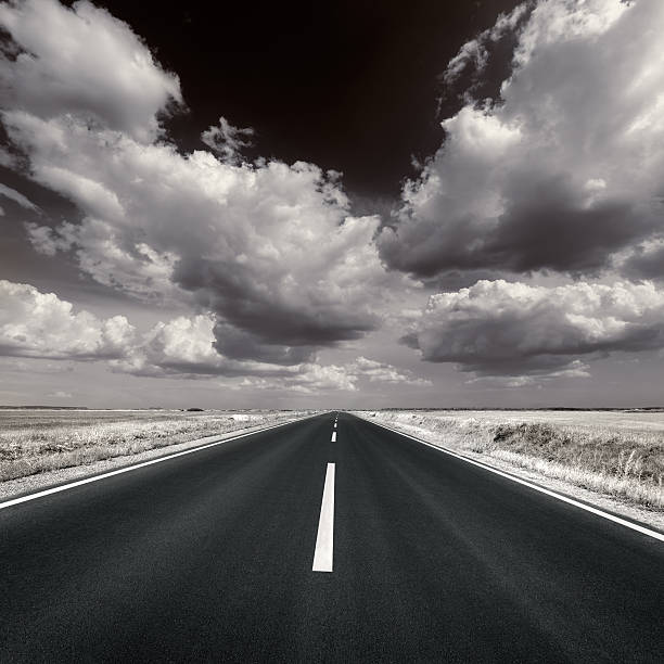 istock Driving on asphalt road in black and white 480582158