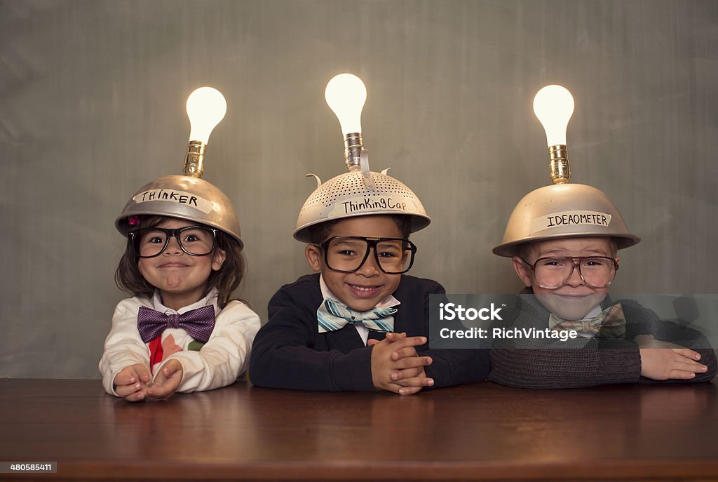 Nerd Children Wearing Lighted Mind Reading Helmets This young group of students are glowing in knowledge. Child Stock Photo