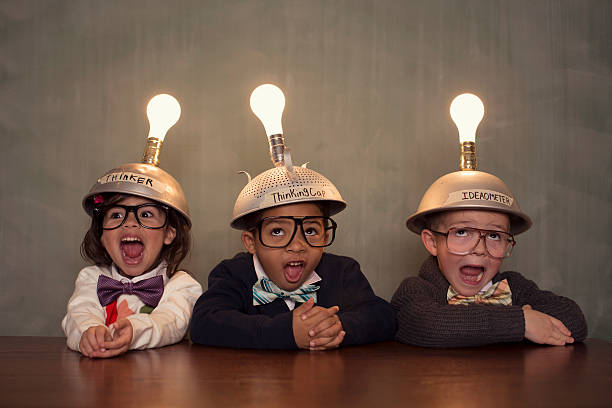 Young Intelligent Children Nerds wearing Thinking Caps Great minds think alike. The big idea is just one inspiratins . bow tie photos stock pictures, royalty-free photos & images