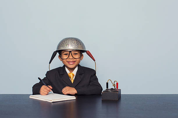 istock Young Boy Wears Brain Helmet Looking for Ideas 480585863