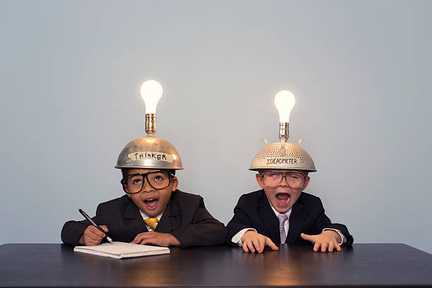 istock Young Business Boys Wearing Business Suits and Thinking Caps 480585921