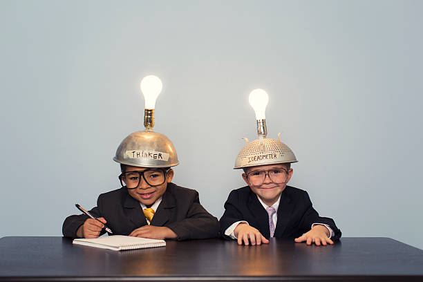 istock Two Business Boys Wearing Lit Up Thinking Caps 480585927