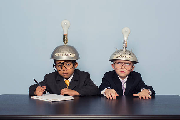 istock Two Business Boys Wearing Thinking Caps are Confused 480585931