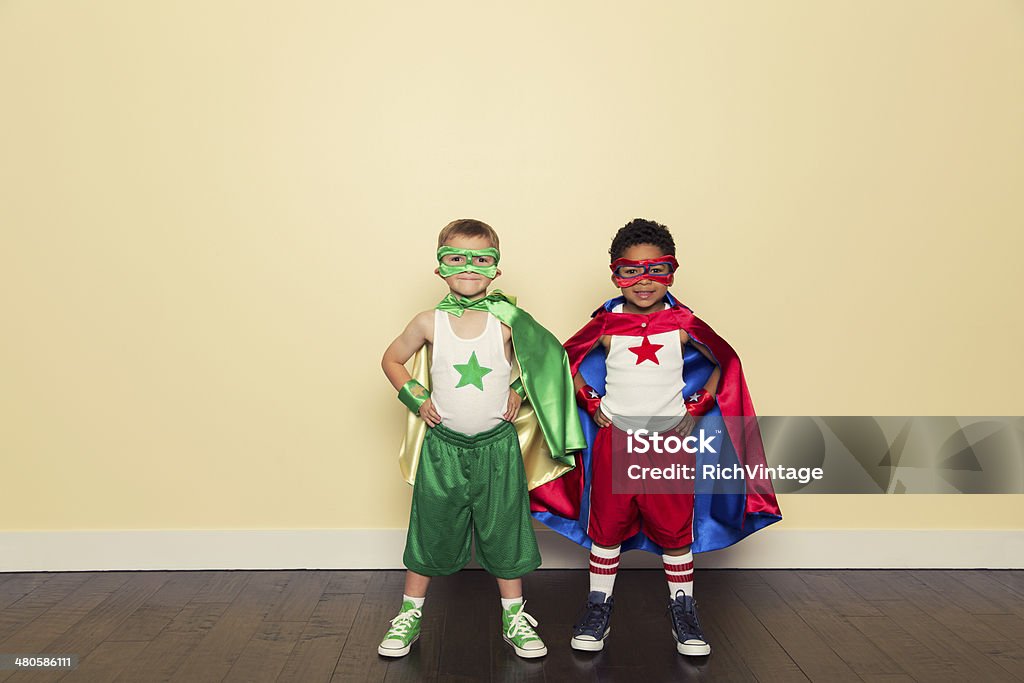 Superheroes Two young superhero partners are ready for any challenge. Heroes Stock Photo