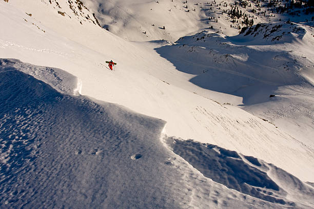 istock Back country snowboarder on his way to the the summit 480586577