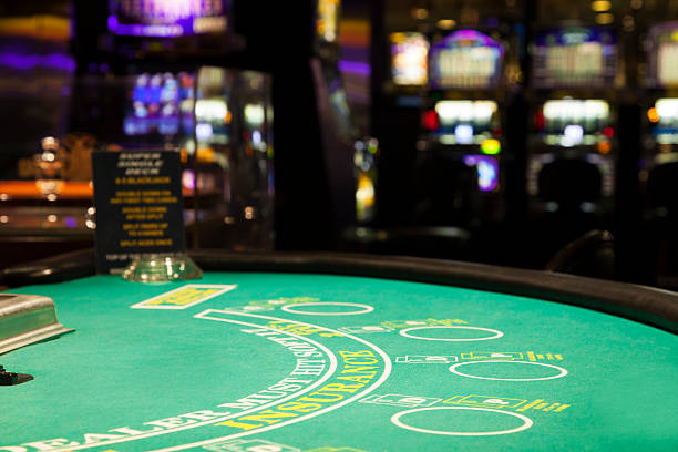 istock Blackjack table and slot machines in a casino 480592213