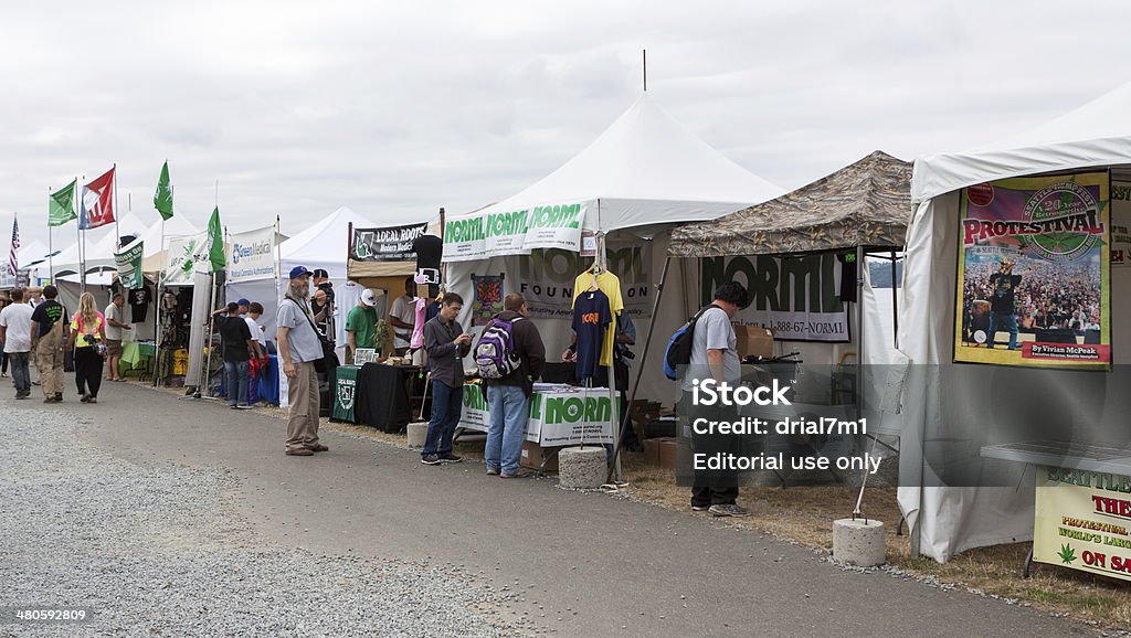 Hempfest Vendor Area 8/19/12 Seattle, United States- August 19, 2012:  The Seattle waterfront was filled with proponents for legalizing marijuana, vendors of hemp products and paraphernalia, and people engaging in recreational drug use. This image shows many people browsing an area of vendor booths. Adult Stock Photo