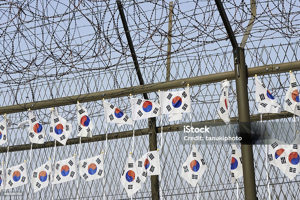 Korean Flags South Korean flags on a barbed-wire fence at Imjiangak Park. Paju. Gyeonggi Province. South Korea. Korea Stock Photo