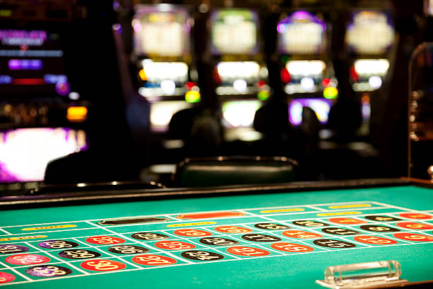 istock Inside of a casino, roulette table and slot machines 480594521