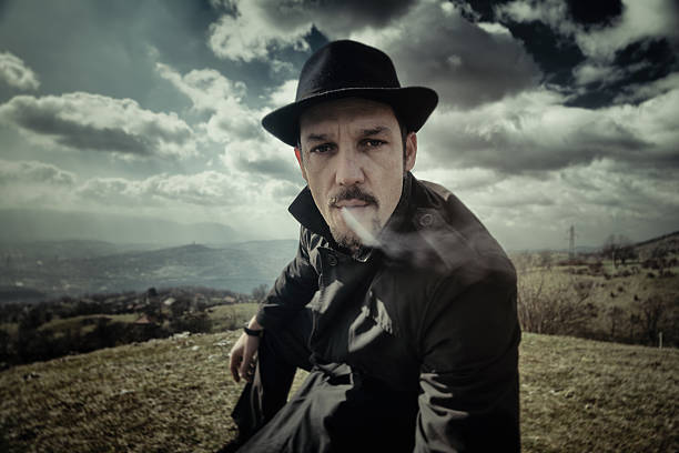 istock Portrait of a man smoking a cigarette 480595593