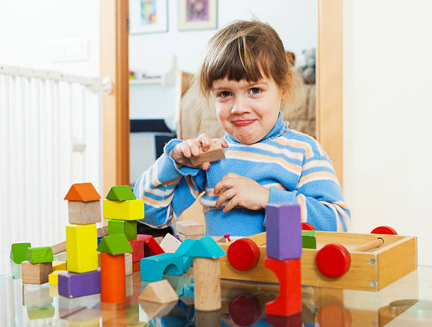 istock 3 years child playing with toys in home 480596867